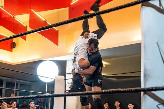 A slam mid-move inside the IDPW ring